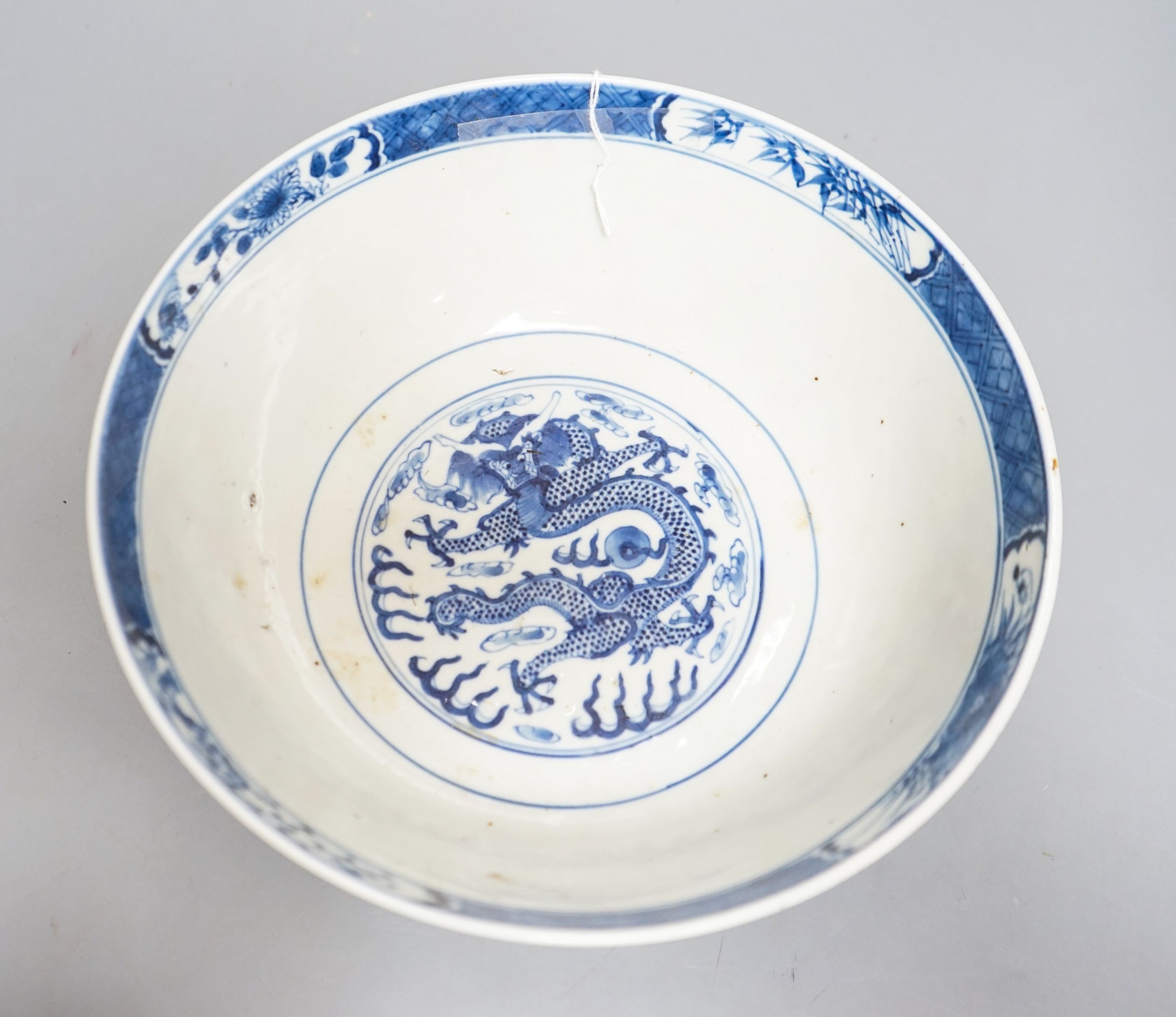 A Chinese blue and white ‘dragon’ bowl, Kangxi mark, late 19th century 25cm